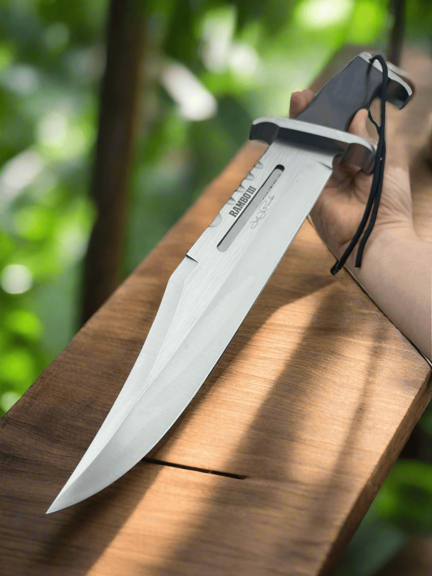 Cskforged Rambo survival knife with D2 steel blade and black handle, designed for outdoor and survival use.