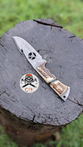 Handcrafted carbon steel hunting knife with antler handle by cskforged, designed for bushcraft and survival outdoor use.