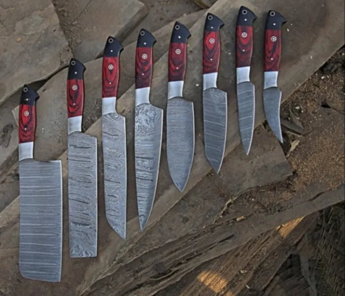 Hand-forged Damascus steel BBQ and chef knife set from Knives Gear Garage, featuring custom, high-quality kitchen knives.