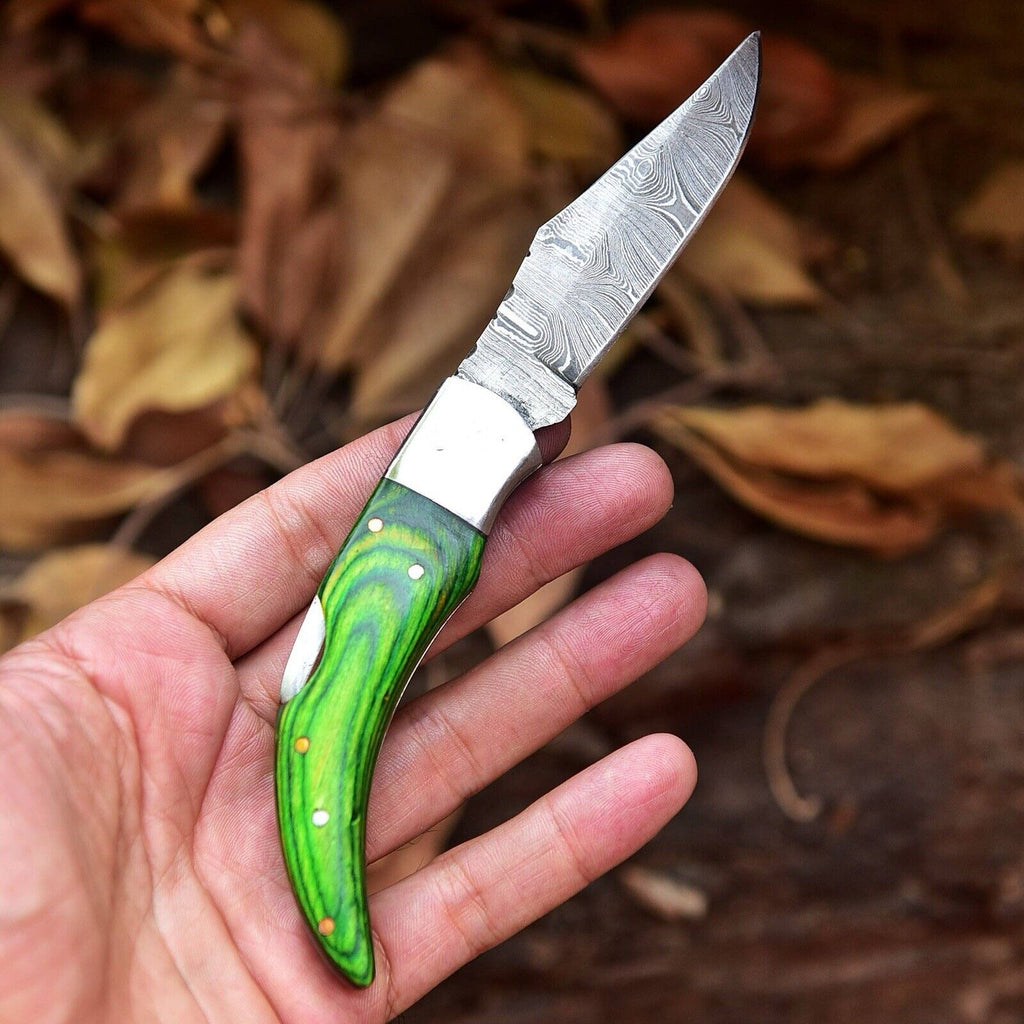 Handmade Damascus folding pocket knife by Knives Gear Garage with rosewood handle and belt loop leather case.