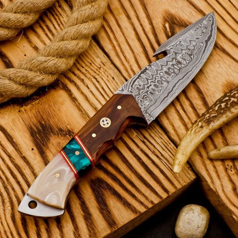 Outdoor hunting camping knife by Knives Gear Garage with a sharp stainless steel blade and ergonomic handle for survival activities.