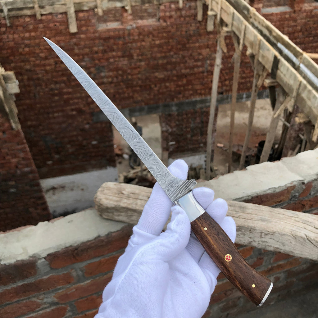 Fishing fillet knife by Knives Gear Garage with a sharp blade and ergonomic handle, perfect for filleting fish.