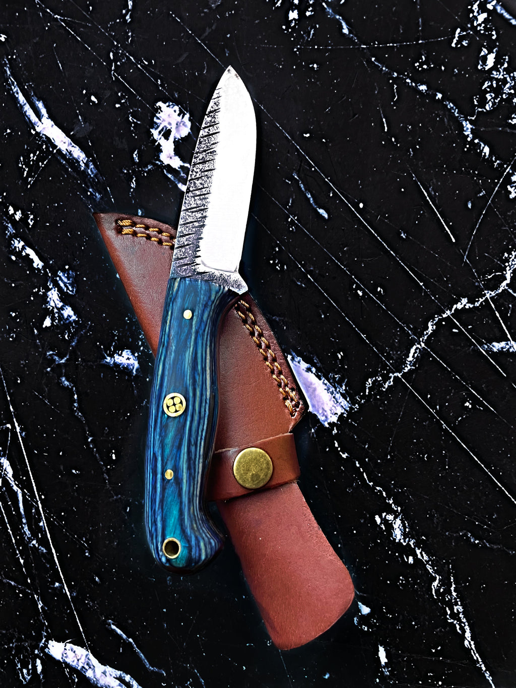 Titan Azura custom hunting and skinning knife with blue diamond wood handle, carbon steel blade, ideal for camping and utility use.