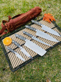 Custom handmade J2 Steel kitchen knife set with G10 handles, steel bolsters, and leather roll kit by Knives Gear Garage.