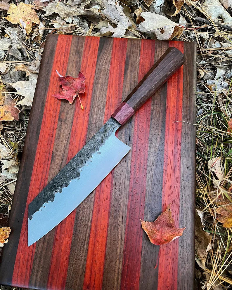 Lightweight chef knife from Knives Gear Garage with a sharp blade and ergonomic handle, ideal for precise kitchen cutting tasks.