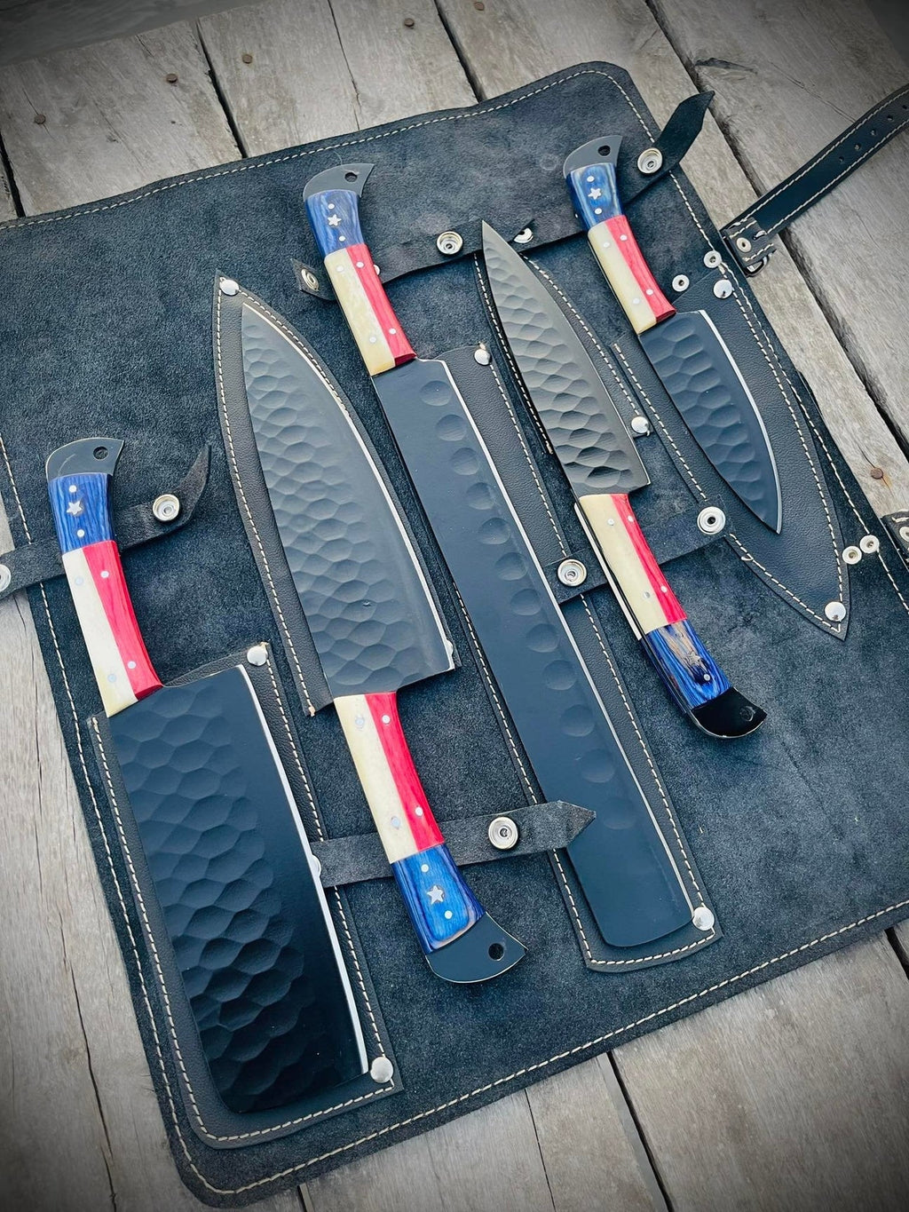 Set of handmade BBQ, chef, and kitchen knives from Knives Gear Garage with wooden handles and stainless steel blades.