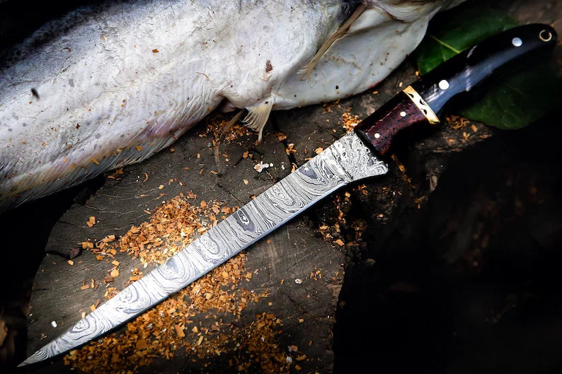 Close-up of a custom 13-inch Damascus steel fillet knife with a Buffalo Horn handle from Knives Gear Garage.