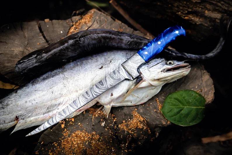 Custom handmade 13-inch Damascus fillet knife by Knives Gear Garage with blue resin handle and Damascus steel bolster.