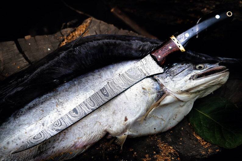 Handmade 13-inch Damascus steel fillet knife with buffalo horn handle, crafted by Knives Gear Garage for precise fish filleting.
