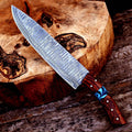 Handmade 7-inch Damascus steel chef knife with rosewood and resin handle, crafted for precision culinary tasks.