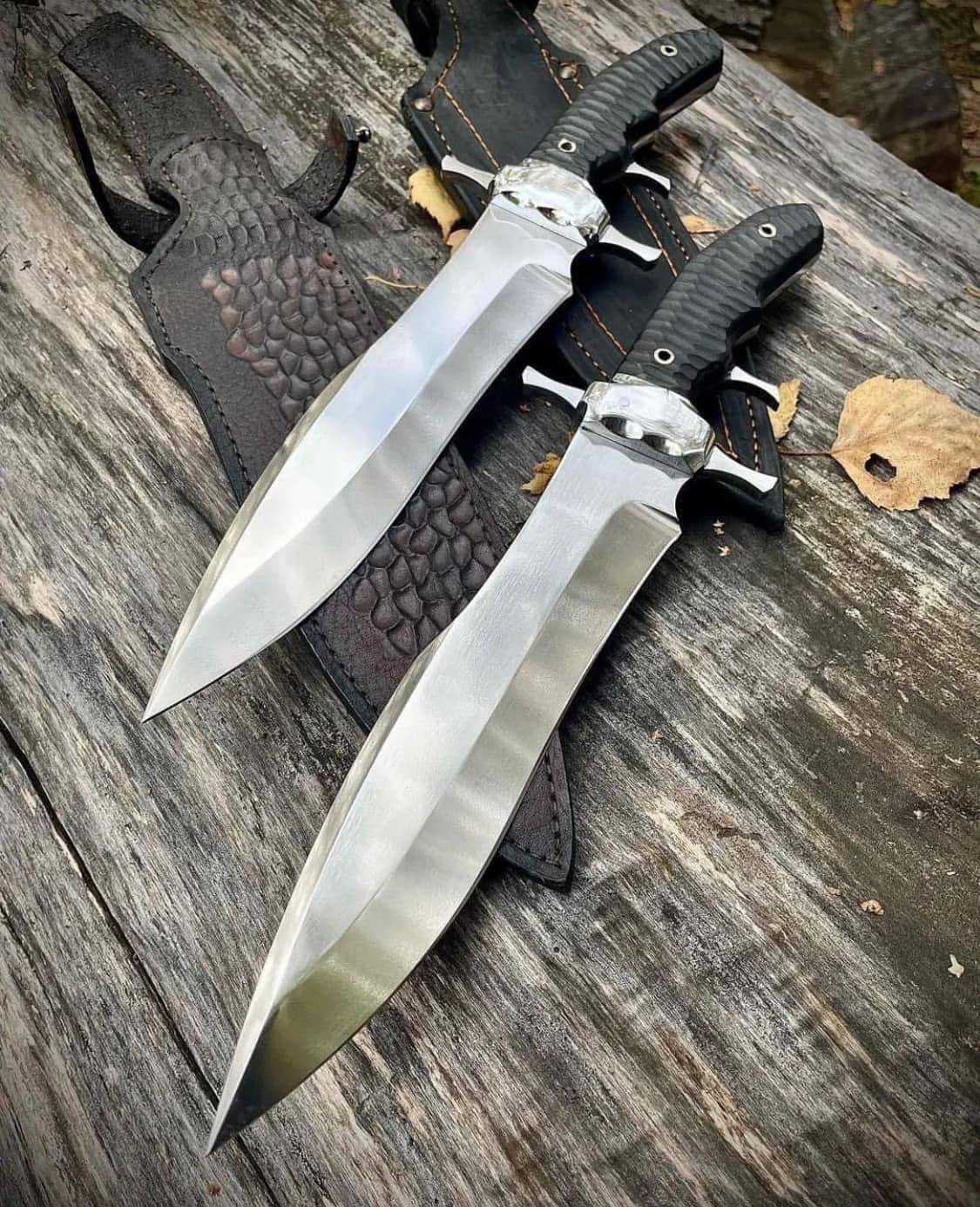 Custom handmade D2 steel Bowie knife by Knives Gear Garage with steel guard, buffalo horn handle, and leather sheath.