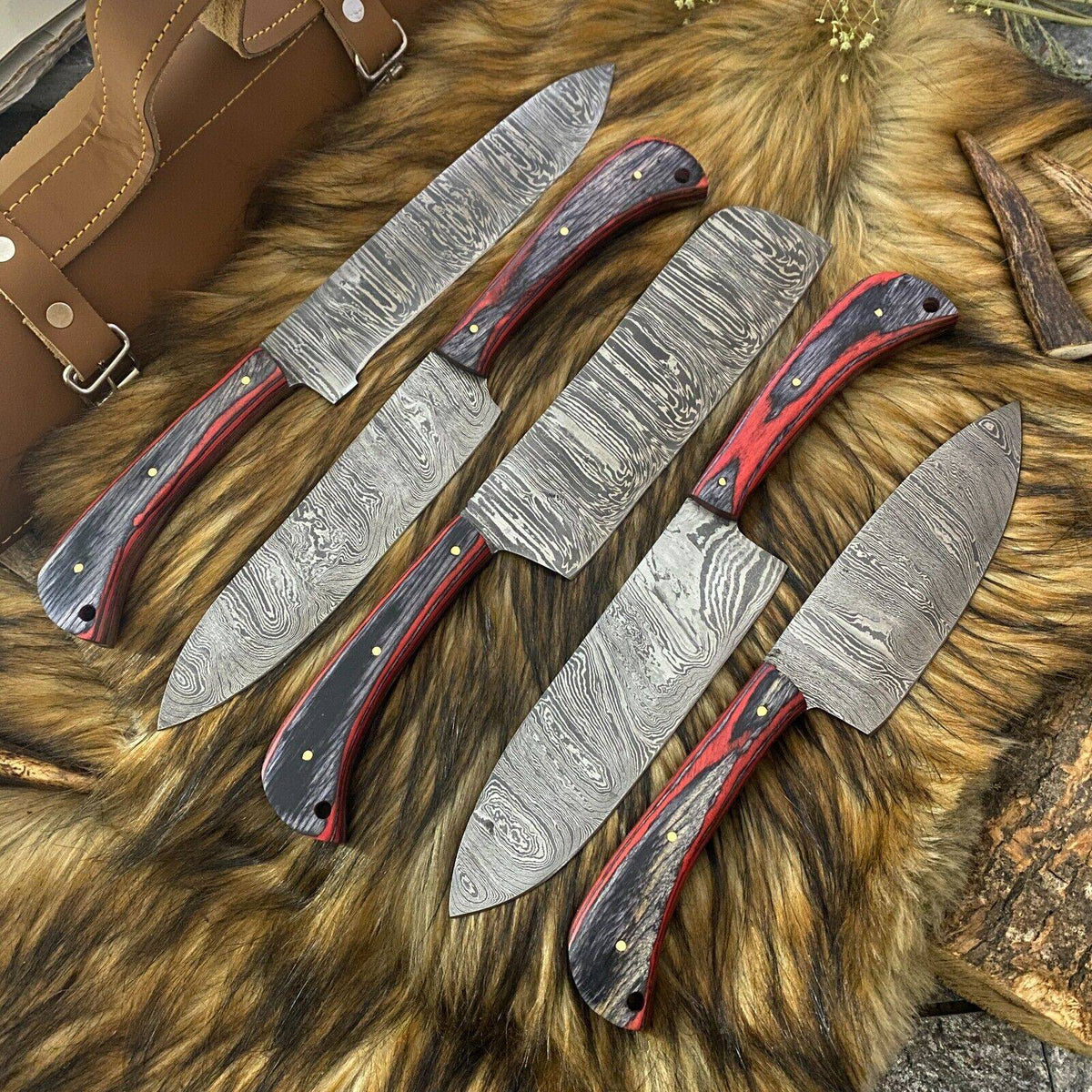 Custom handmade Damascus steel kitchen knives set with Pakkawood handles, featuring sharp blades and elegant craftsmanship.