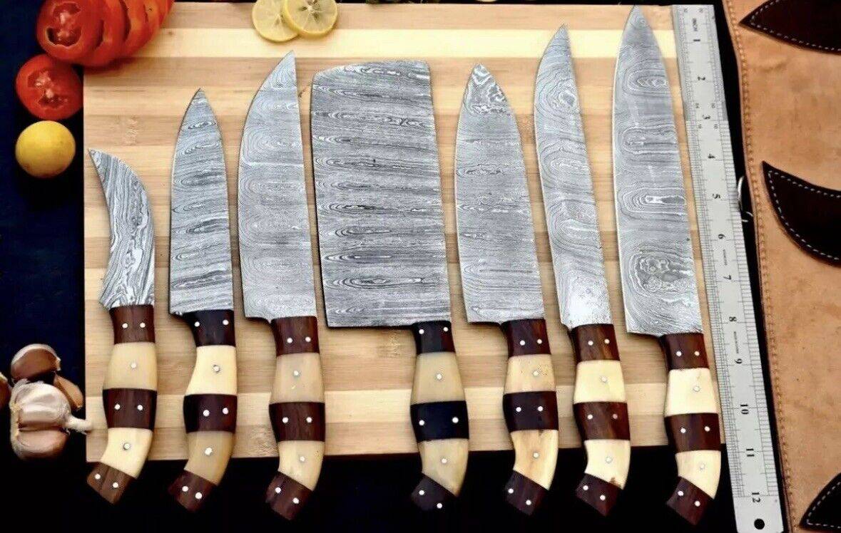 Handmade Damascus chef knife set with 9-13 inch blades and rosewood and olive wood handles, showcasing craftsmanship and quality.