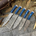 Custom handmade Damascus knife set with resin handles, featuring hand-forged steel blades from 3 to 8 inches for kitchen use.
