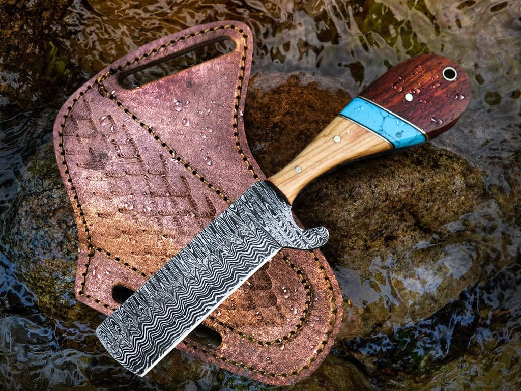 Custom handmade Bull Cutter knife by Texan Knives with a 4-inch Damascus steel blade and turquoise pakkawood handle.