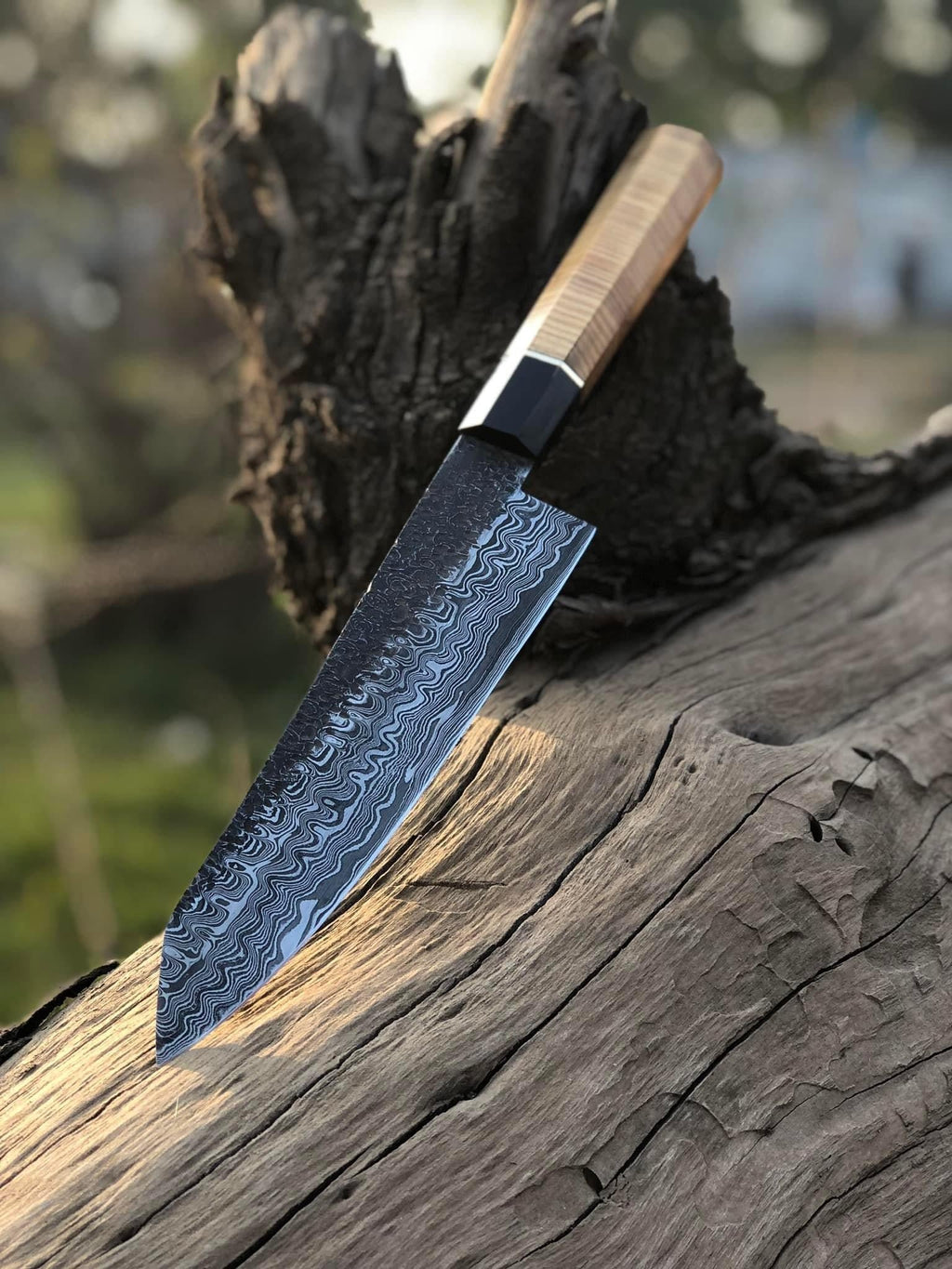 Handmade 13-inch Damascus steel chef knife with brass guard and olive wood handle, includes leather sheath.