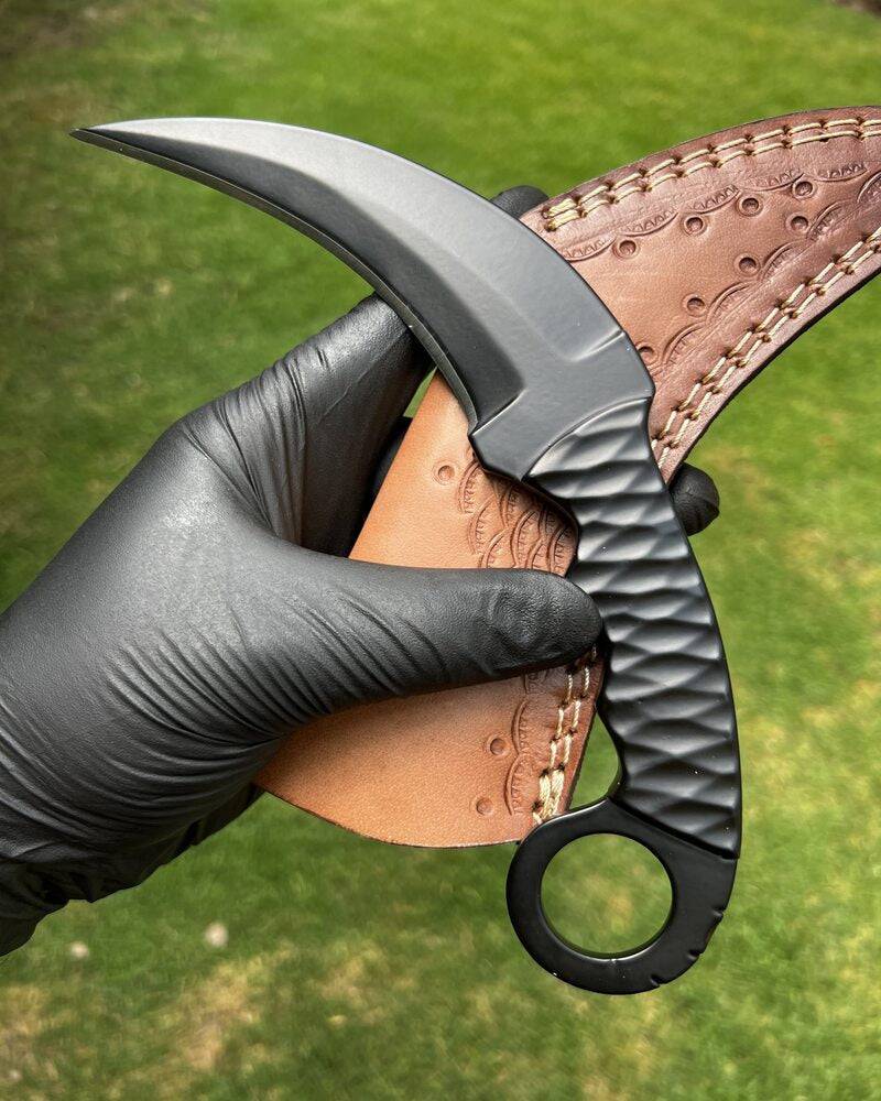 Black Karambit knife from Knives Gear Garage with a powder-coated finish, featuring a curved blade suitable for EDC use.