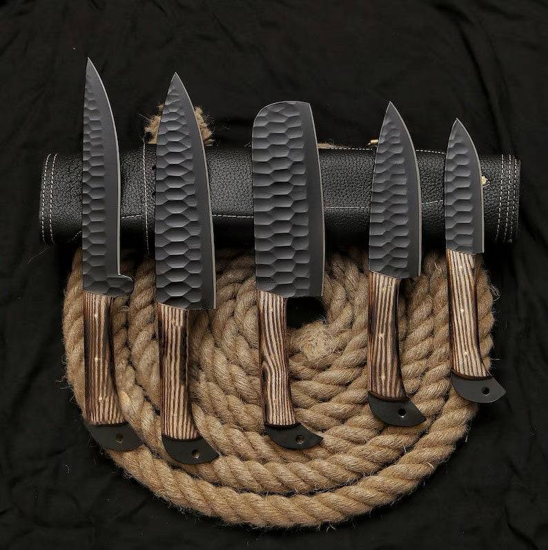 Set of stainless steel kitchen knives from Knives Gear Garage, displayed with ergonomic handles on a wooden cutting board.