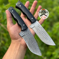Pair of premium hand-forged Damascus steel hunting knives with ergonomic black handles by cskforged, featuring high-performance blades.