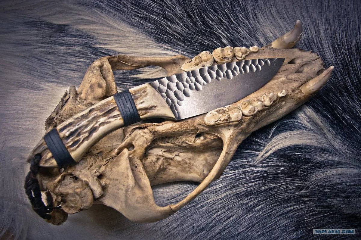Handmade skinning hunting knife from Knives Gear Garage with a sharp blade and durable handle, ideal for outdoor hunting activities.