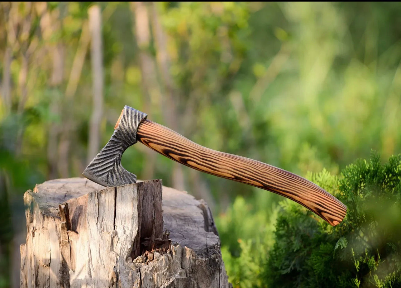 Handmade carbon steel Viking battle axe with wooden handle, featuring detailed blade and rustic finish.