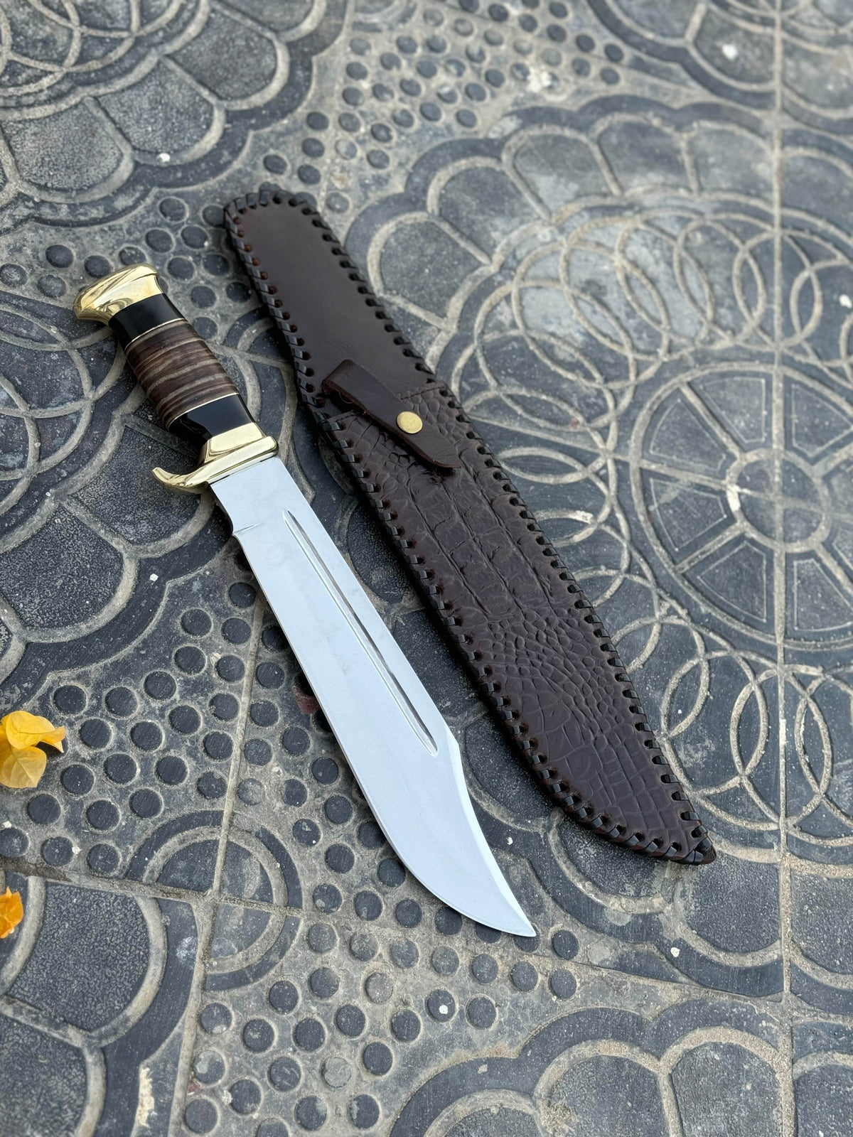 Custom handmade J2 steel Bowie knife with brass guard and leather handle, 16-inch size, crafted by Knives Gear Garage.