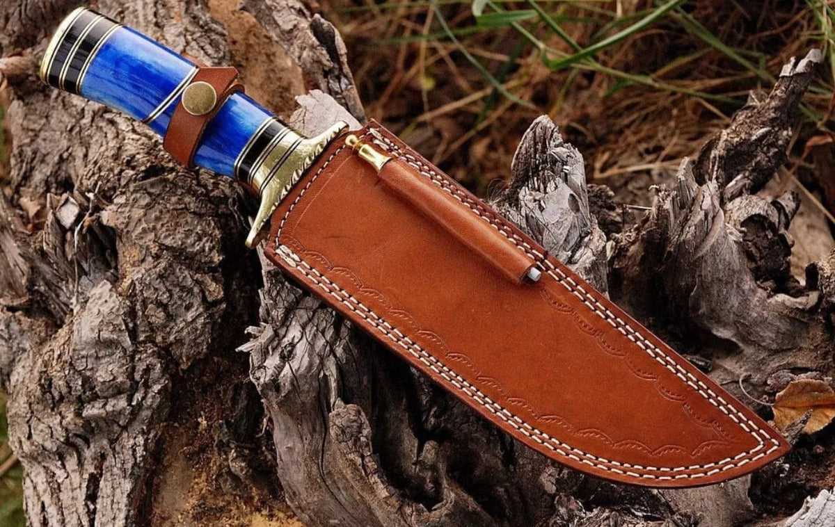 Premium handmade Damascus steel Bowie knife with brass guard, colorful bone handle, leather sheath from Knives Gear Garage.
