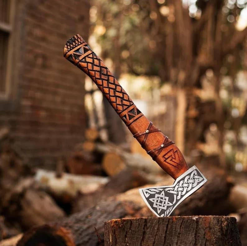 Handmade Viking axe hatchet with forged wood handle, crafted by Knives Gear Garage, showing the detailed blade and rustic wooden grip.