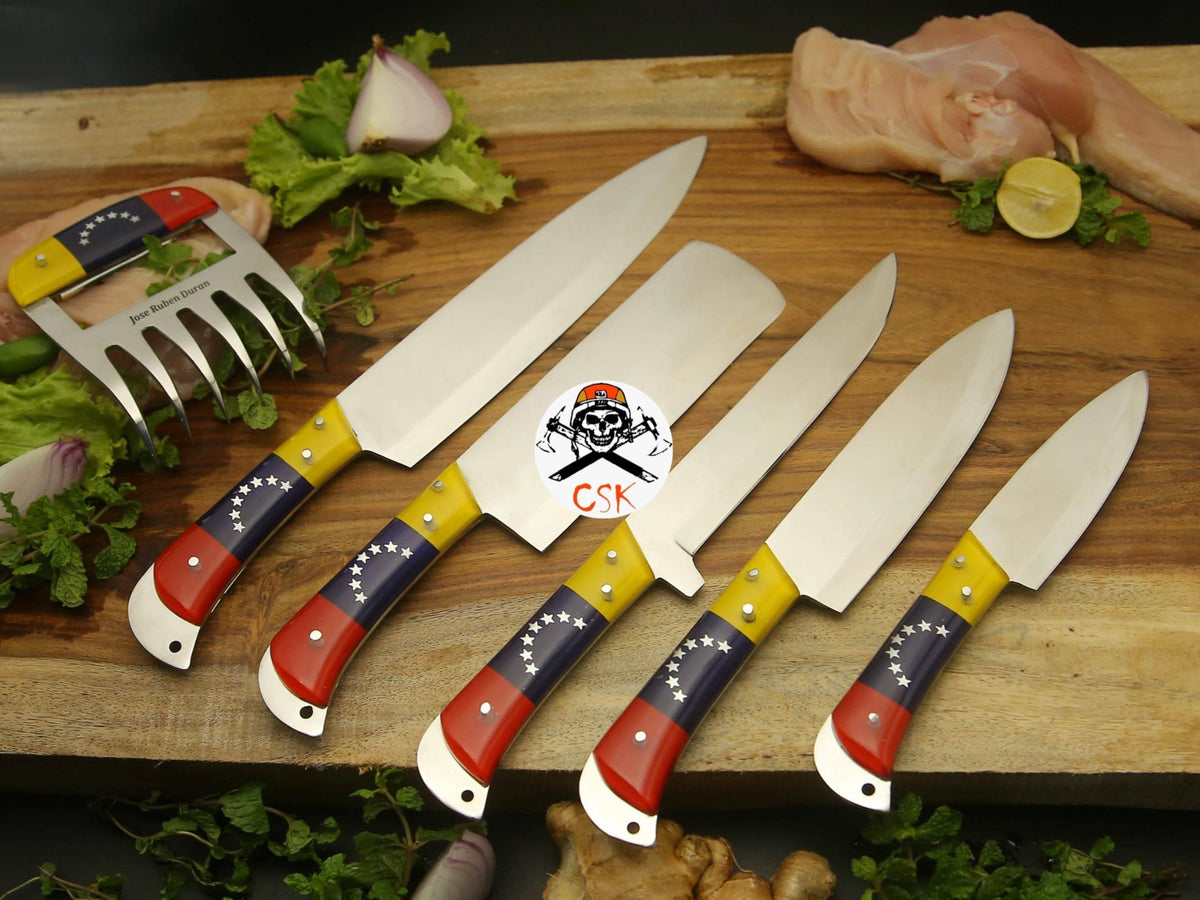 Hand forged flag-inspired chef knife by cskforged with a detailed blade and sturdy handle, perfect for precise kitchen cutting tasks.