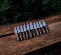 CSKforged Buckaroo Western Cutlery EDC knife with rosewood handle, showcasing its durable blade and polished wood grip.