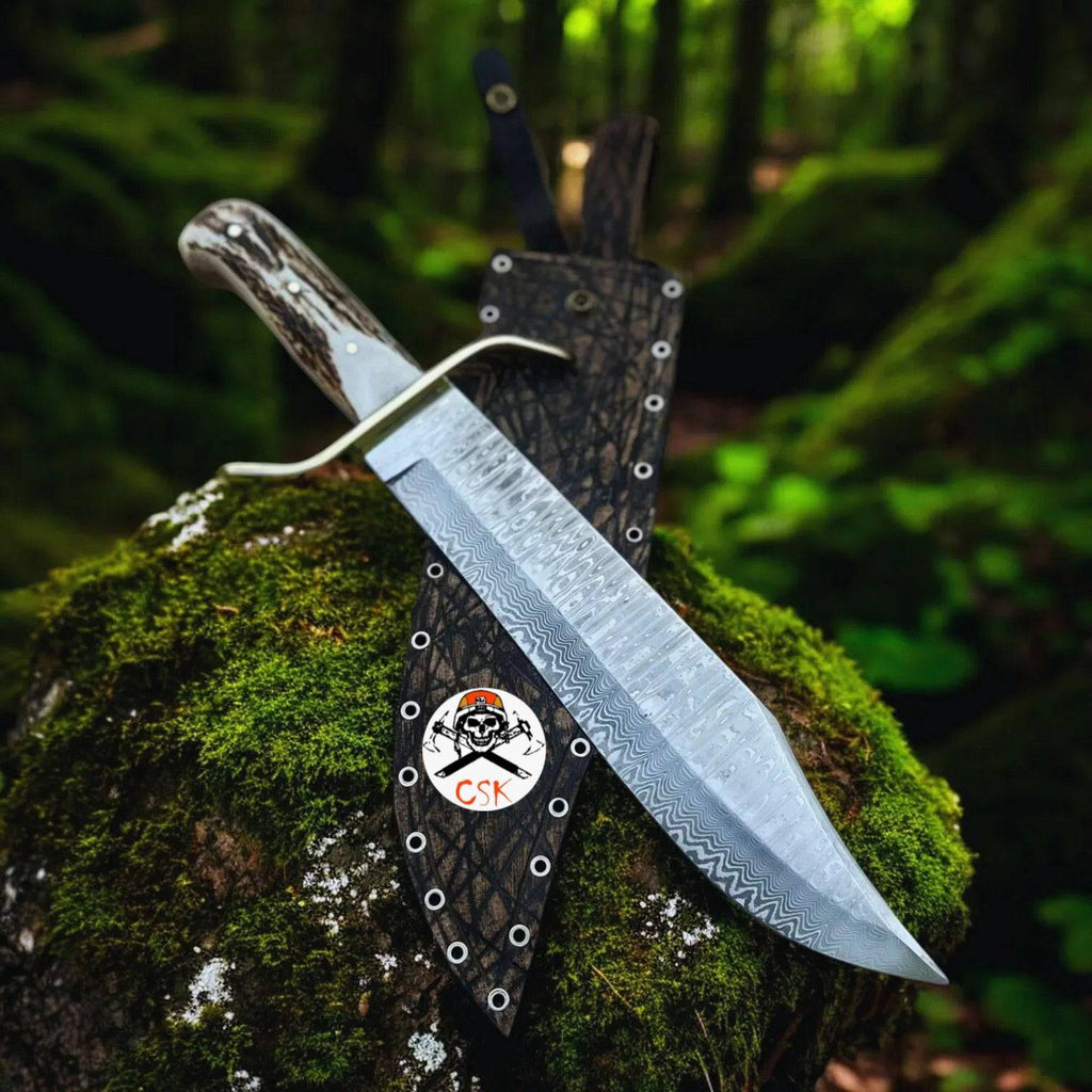 cskforged SS Damascus stag hunting knife with custom leather sheath, featuring intricate Damascus blade and stag handle design
