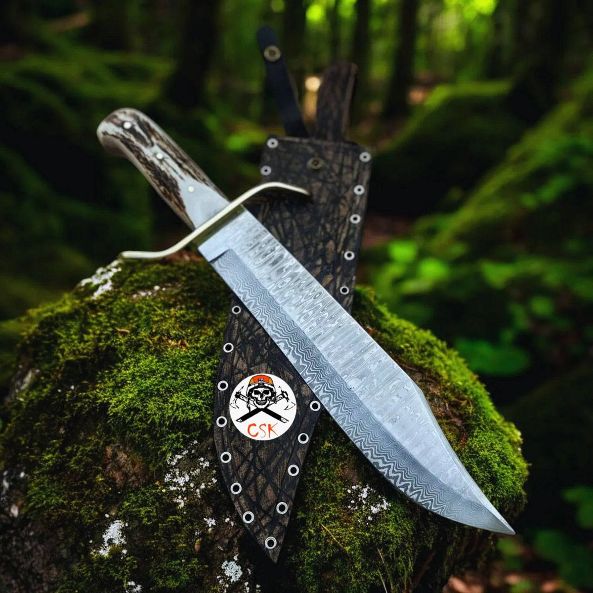 cskforged SS Damascus stag hunting knife with custom leather sheath, featuring intricate Damascus blade and stag handle design