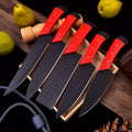 Set of stainless steel kitchen knives from Knives Gear Garage with black handles, arranged on a wooden countertop.