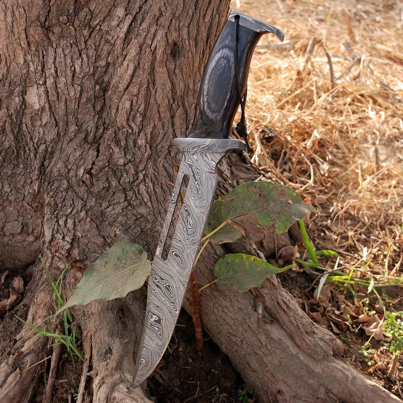 Custom handmade Damascus steel Rambo Bowie knife with brass wood handle and leather sheath, crafted by Knives Gear Garage.