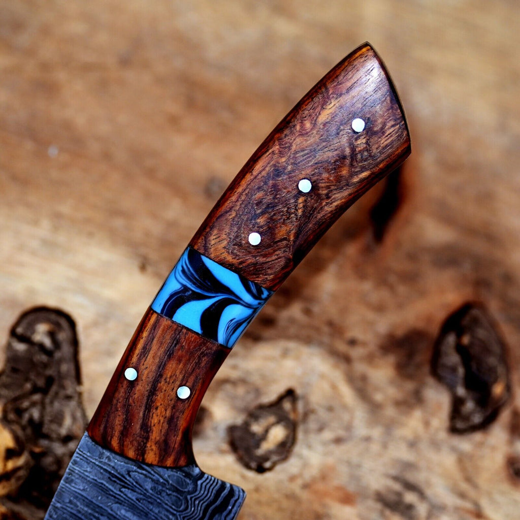 Handmade Damascus steel chef knife with rosewood and resin handle, 7-inch blade, ideal for precision cutting in the kitchen.