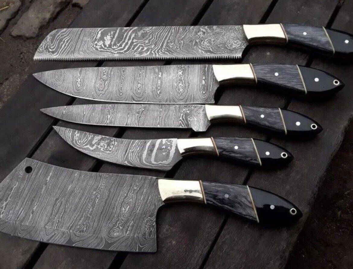 Handmade Damascus steel kitchen knives set with pakkawood and buffalo horn handles, steel bolster, and leather sheath.