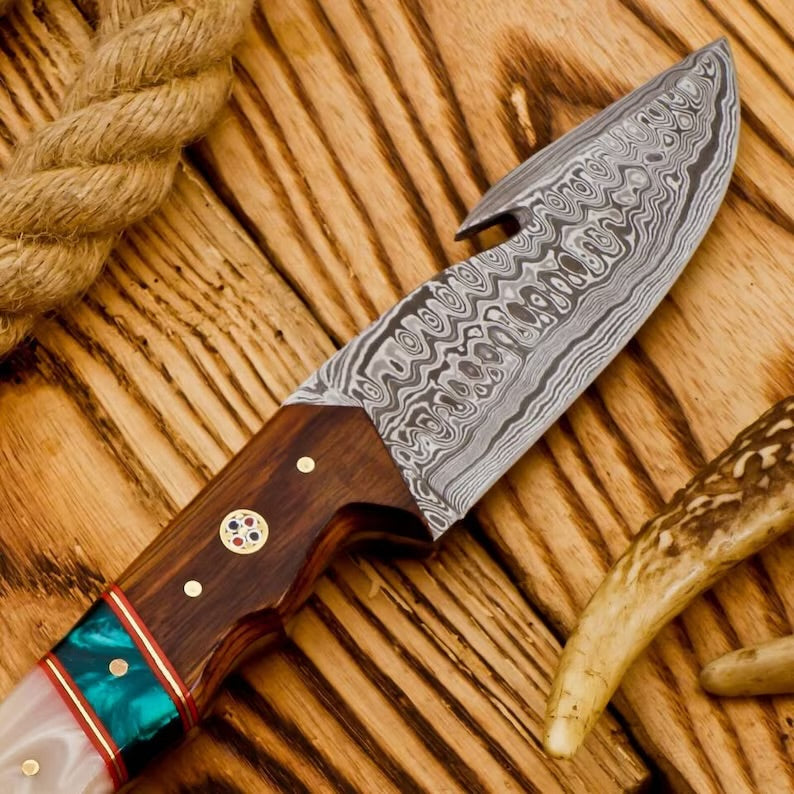 Knives Gear Garage hunting camping knife with a black handle and sharp stainless steel blade, ideal for outdoor survival and camping tasks.