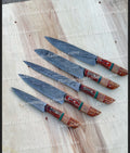Custom handmade Damascus kitchen knife by Knives Gear Garage with a patterned blade and wooden handle.