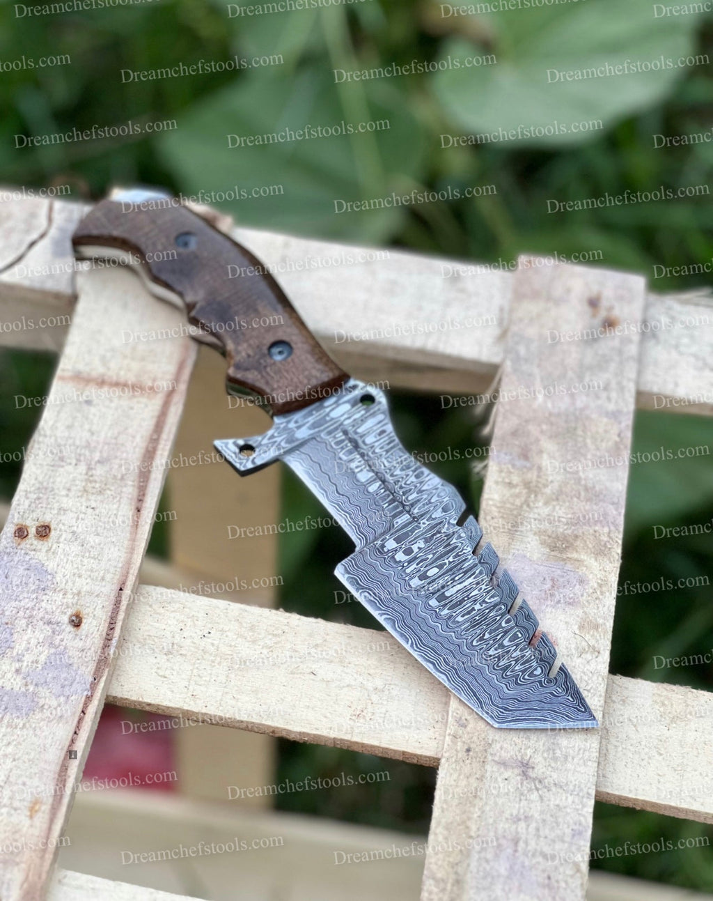 Custom handmade Damascus steel tracker knife with a textured handle, crafted by Knives Gear Garage.
