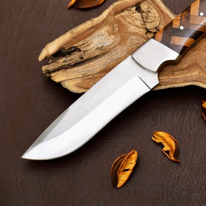 Handmade D2 steel hunting knife with wooden handle and leather sheath, crafted by Knives Gear Garage.
