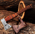 Handmade Viking axe hatchet with a forged metal blade and wooden handle, displayed on a neutral background.