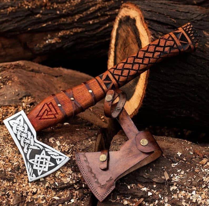 Handmade Viking axe hatchet with a forged metal blade and wooden handle, displayed on a neutral background.