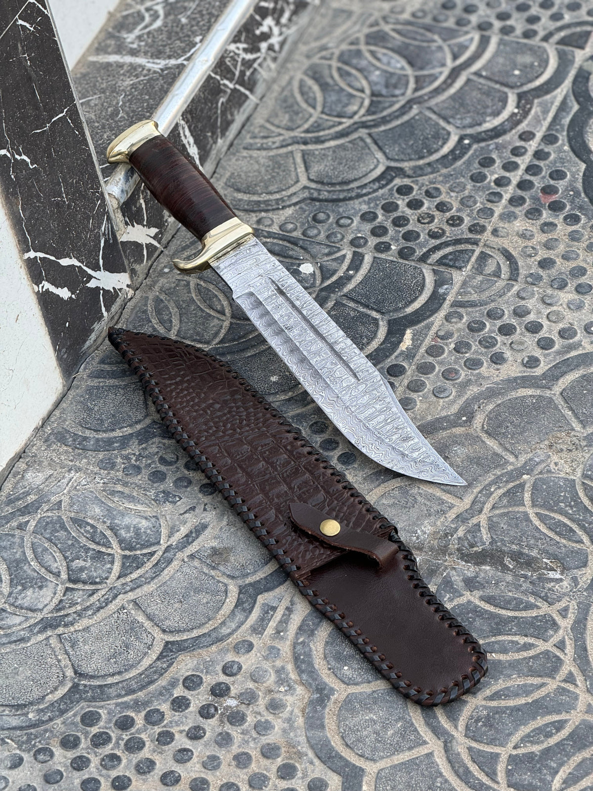 Handmade Damascus steel Bowie knife with brass guard and leather handle, 16-inch custom Crocodile Dundee style knife by Knives Gear Garage