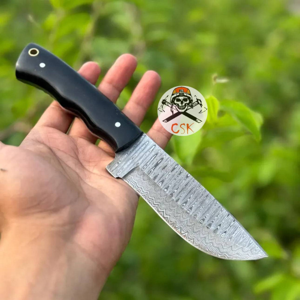 Premium cskforged hand-forged Damascus steel hunting knife with ergonomic black handle and high-performance blade.