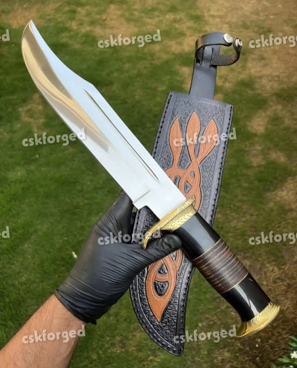 D2 Steel Dundee blood-grooved hunting knife by cskforged with a leather handle and full tang blade, suited for outdoor hunting.