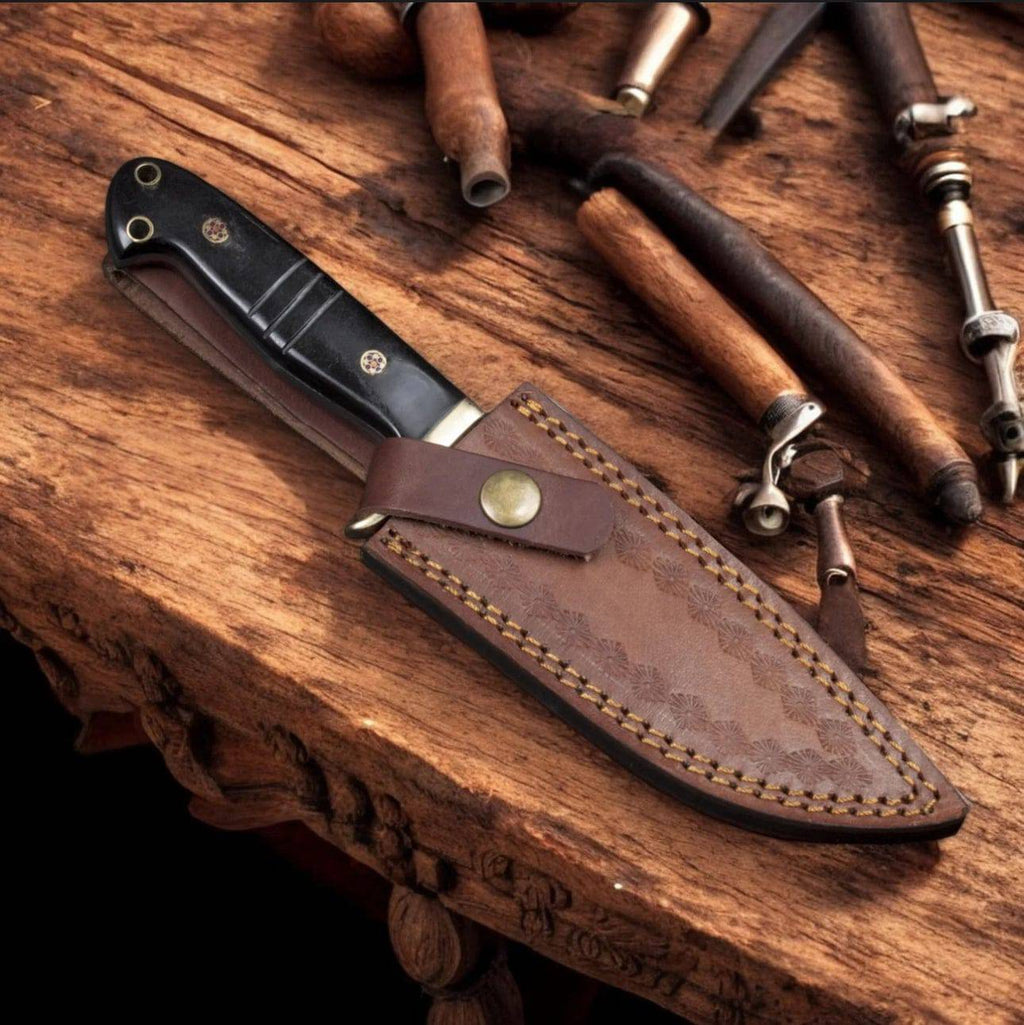 Hand forged Damascus steel drop point hunter knife by cskforged, featuring a textured blade and ergonomic handle for outdoor hunting.