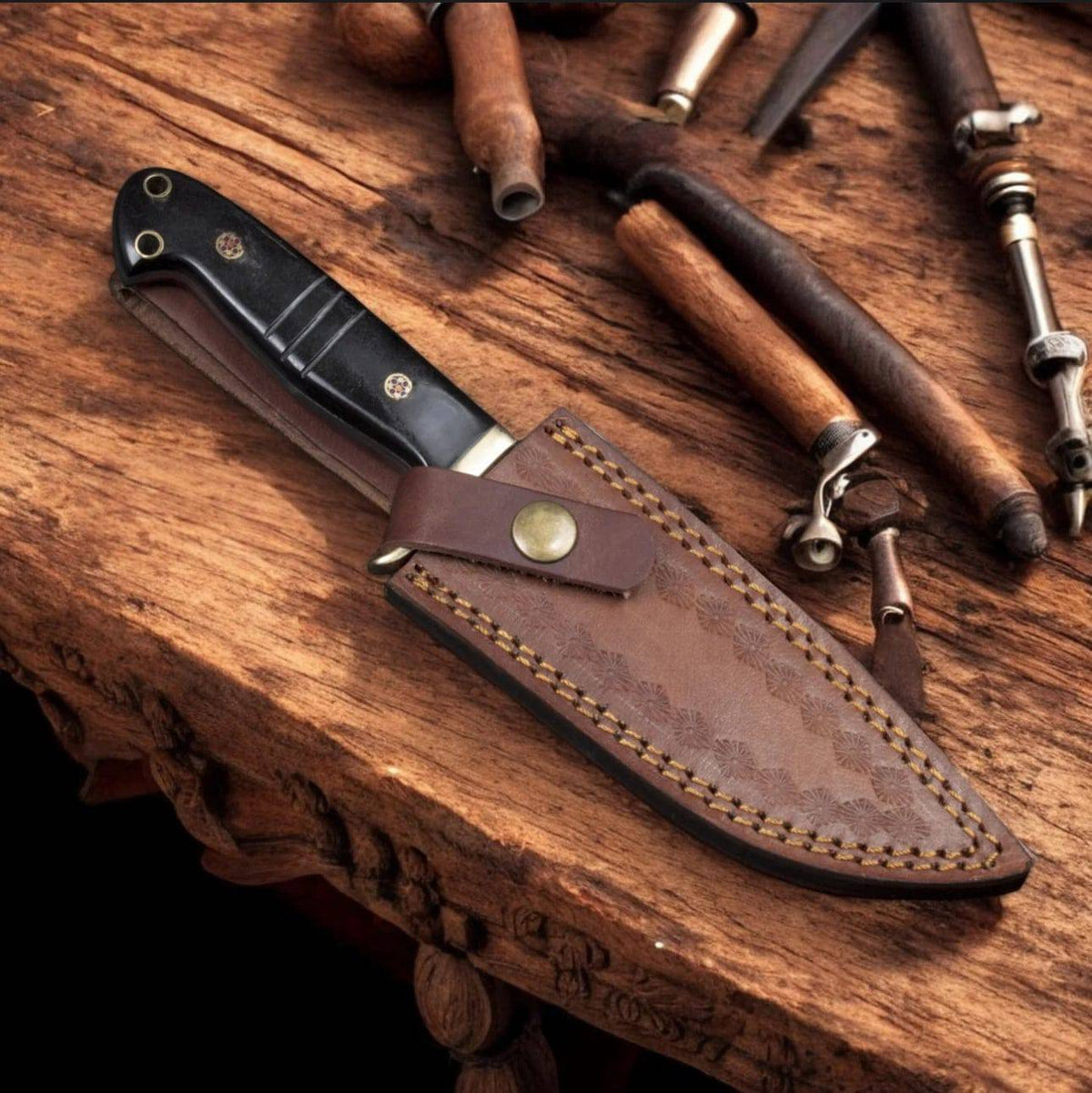 Hand forged Damascus steel drop point hunter knife by cskforged, featuring a textured blade and ergonomic handle for outdoor hunting.