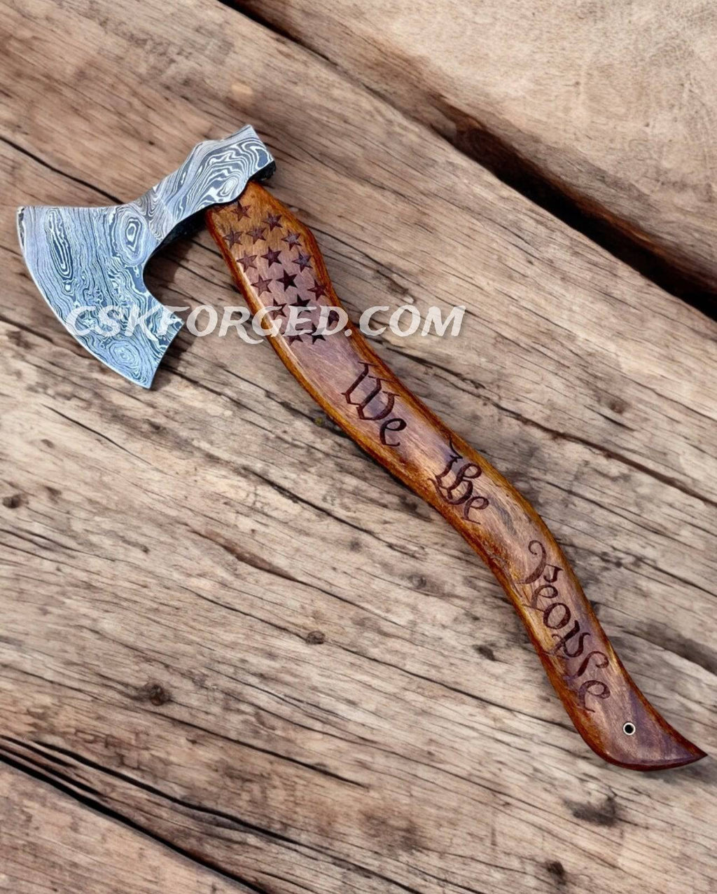 American Mahogany Damascus 20-inch We the People chopper hunting knife by cskforged with a detailed, full tang blade and decorative handle.