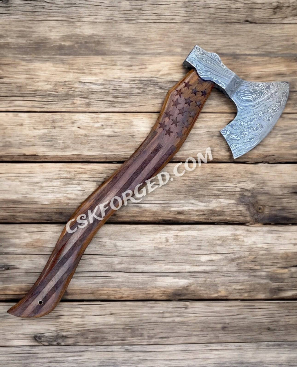 American Mahogany Damascus 20-inch We the People chopper hunting knife by cskforged with a detailed Damascus blade and wooden handle.