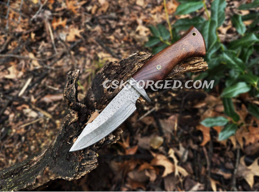Cskforged Bobcat Damascus steel hunting knife with rose wood handle, full view showcasing craftsmanship and sharp blade.